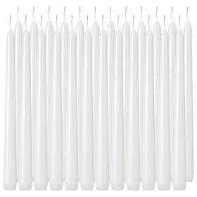 Tuyai 10 inch white dripless taper candle on a dining table for elegant ambience