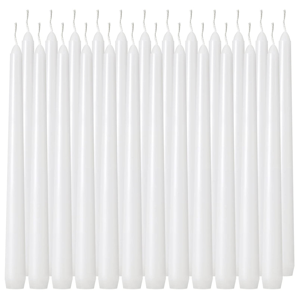 Tuyai 10 inch white dripless taper candle on a dining table for elegant ambience