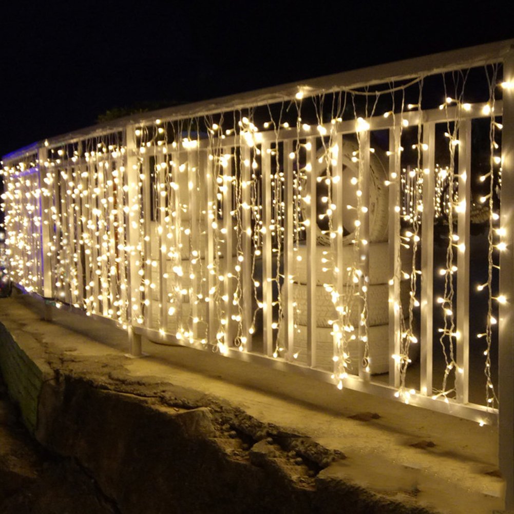 Twinkle Star 600 LED curtain lights enhance bedroom ambience with gentle illumination.