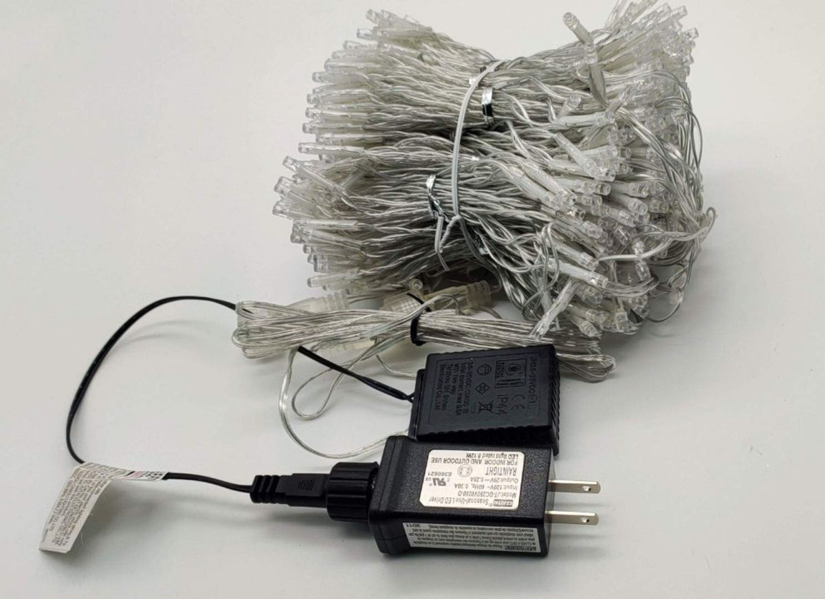 Twinkle Star 600 LED curtain lights include IP44 transformer for safe outdoor use.