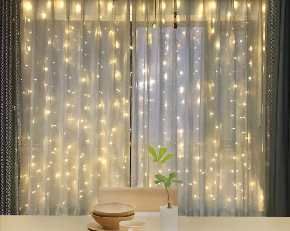 Twinkle Star 600 LED curtain lights ideal for outdoor wedding decor and events.