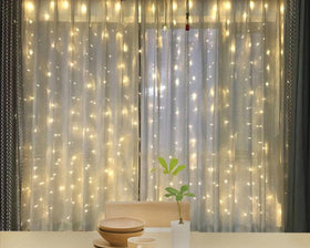 Twinkle Star 600 LED curtain lights ideal for outdoor wedding decor and events.