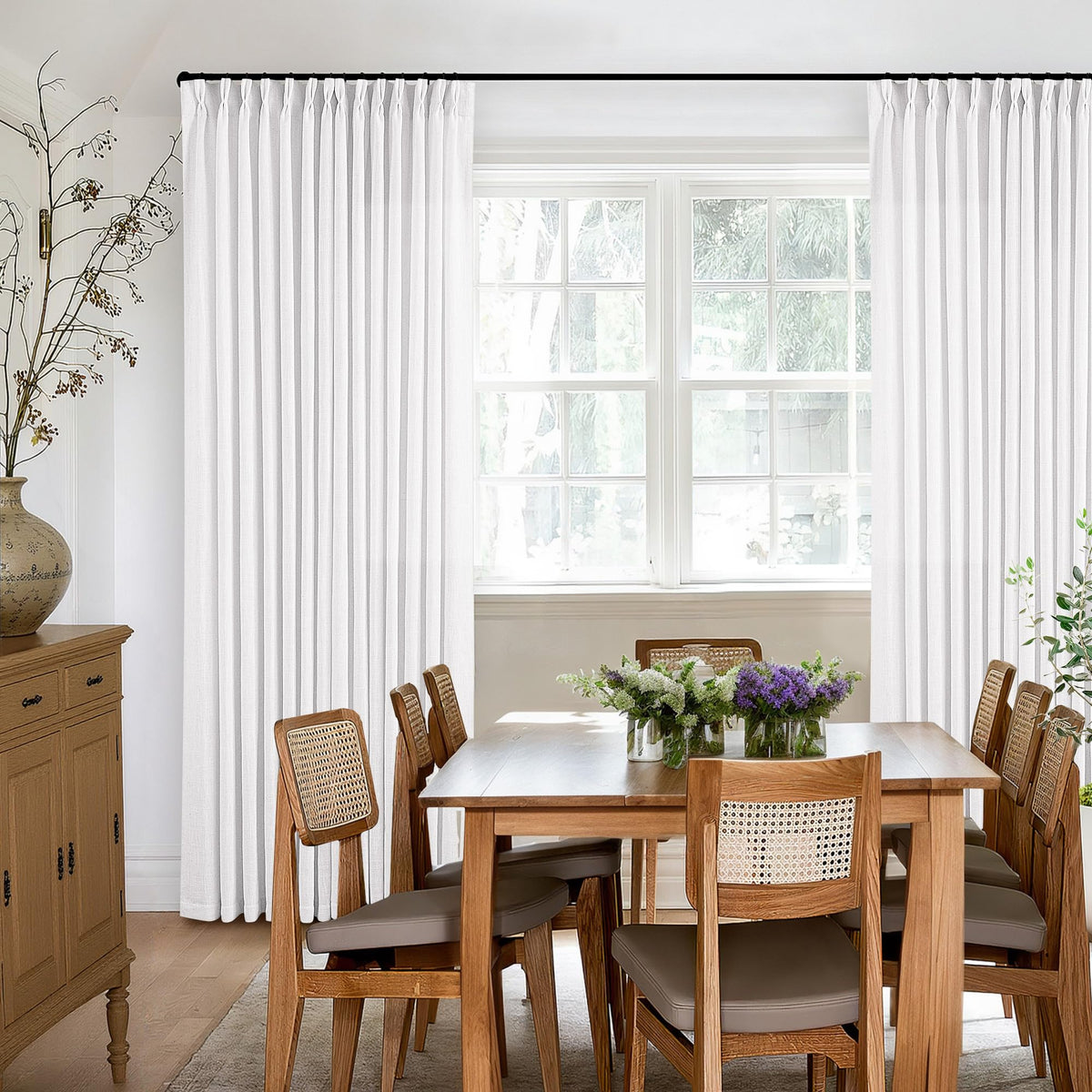 TWODRAPES ceiling-to-floor linen drape adds a luxurious room presence.