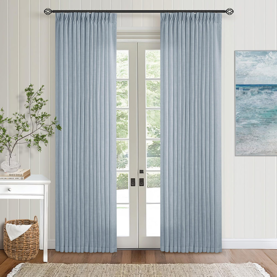 TWODRAPES dusty blue pinch-pleated linen curtains offer refined style and light diffusion.