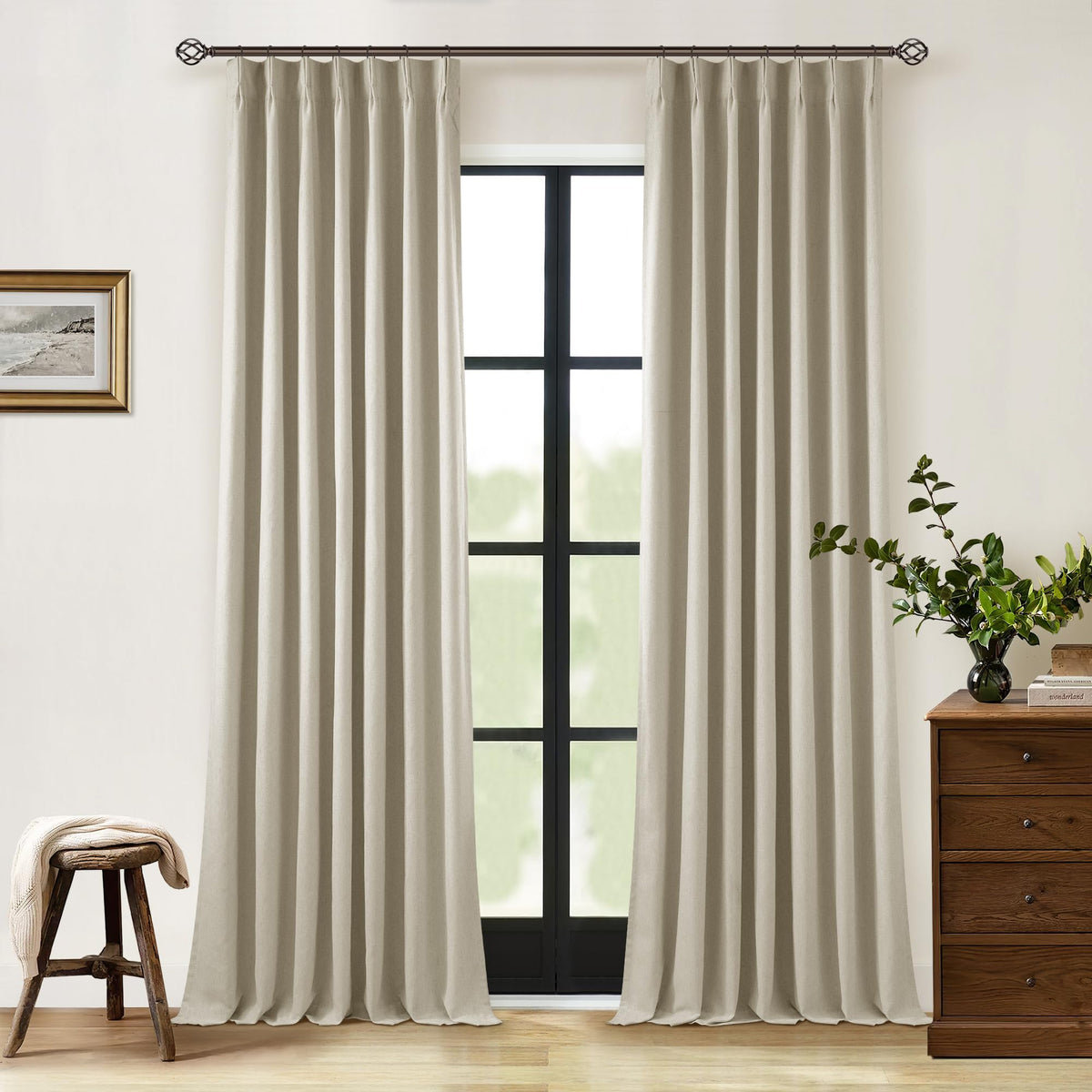 TWODRAPES Neutral pinch-pleat linen blackout curtains offer privacy and total darkness.