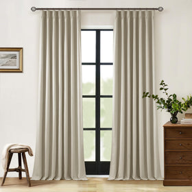 TWODRAPES Neutral pinch-pleat linen blackout curtains offer privacy and total darkness.