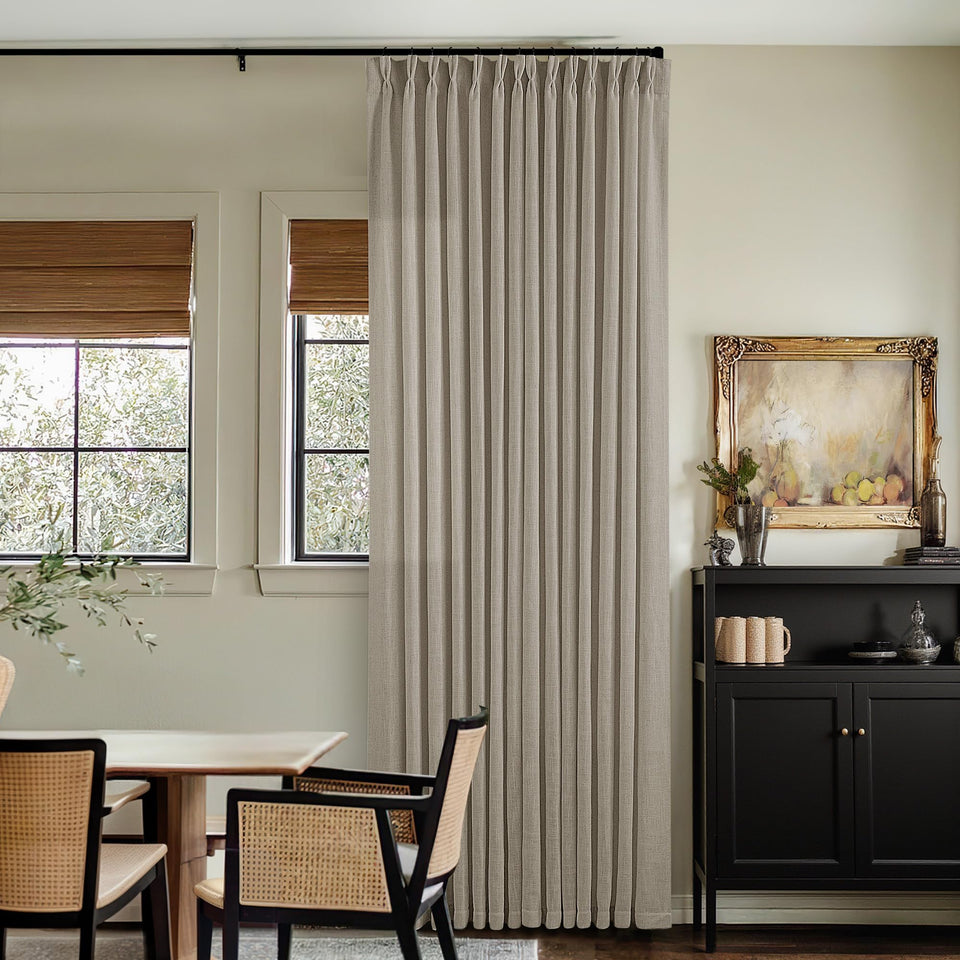 TWODRAPES pinch-pleat linen curtains 108in frame a refined living room with soft, diffused light.