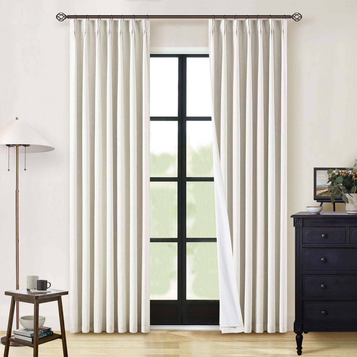 TWODRAPES pinch-pleat linen panels retain their shape for a neat window display.