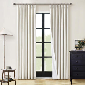 TWODRAPES pinch-pleat linen panels retain their shape for a neat window display.