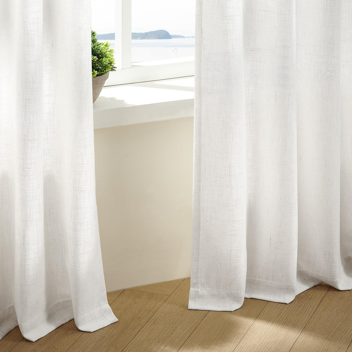 TWODRAPES ready-made two-panel curtains include hooks and rings for quick setup.