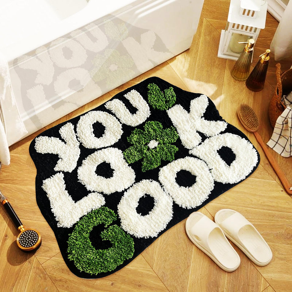 TWWDE AUG You Look Good bath rug in black with ultra-soft microfiber for quick absorption.