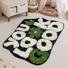 You Look Good bath rug features a flower design to enhance decor.