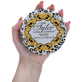 Tyler Candle ambient glow fills rooms with inviting fragrance.