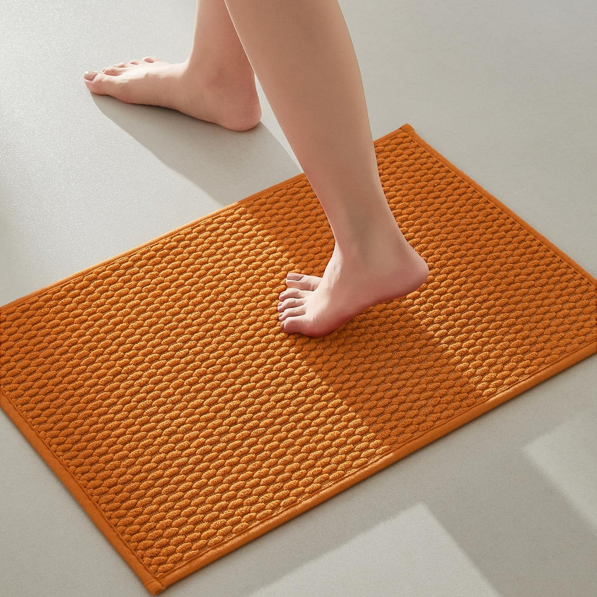 TYUU bathroom rug orange front view highlighting non-slip surface for safer exits