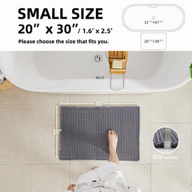 TYUU non-slip backing keeps this grey mat firmly in place on smooth bathroom floors.