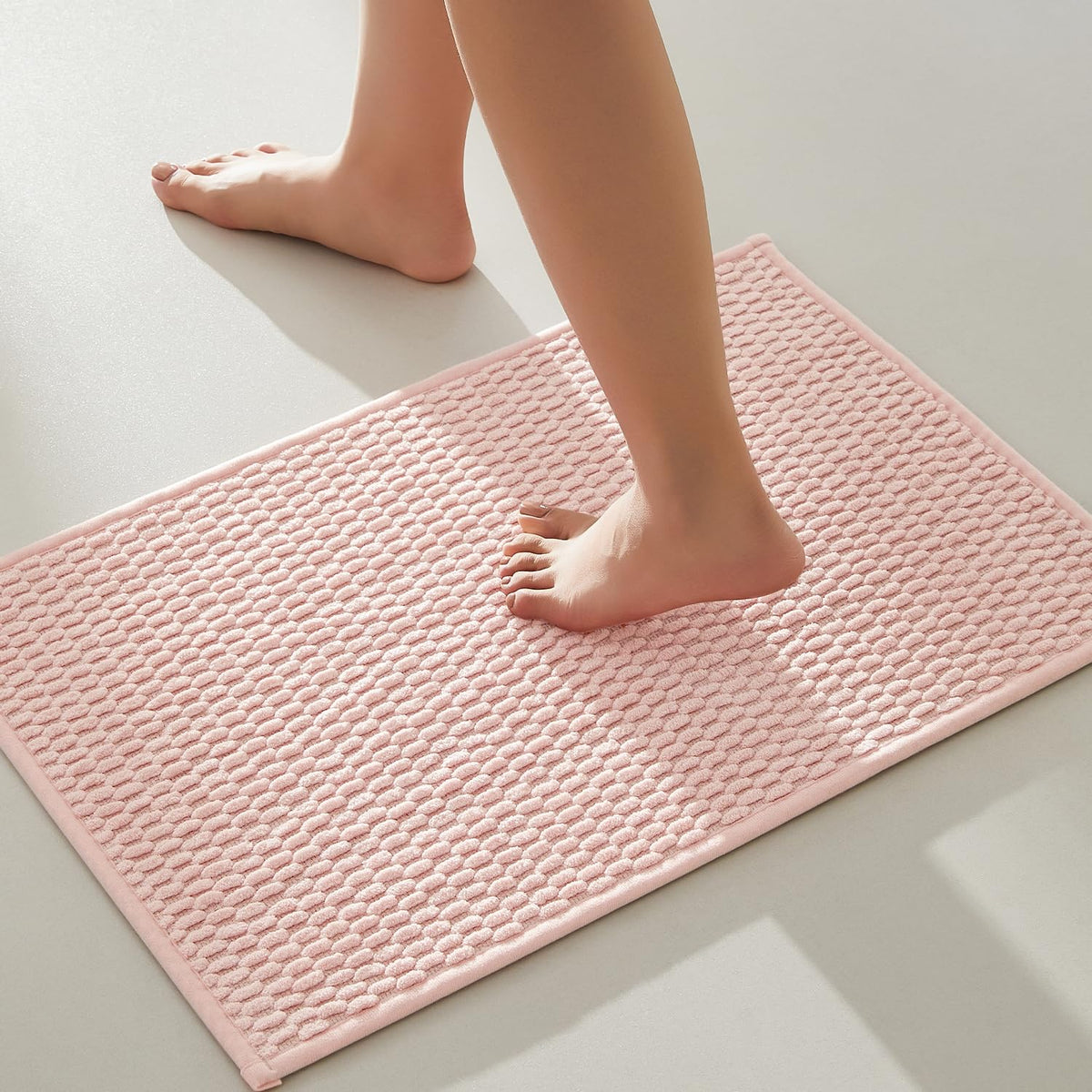 TYUU pink bathroom rug with non-slip backing for safer steps on tile