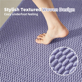 TYUU natural rubber backing enhances stability on smooth bathroom floors.
