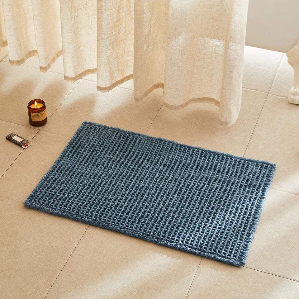 TYUU waffle bath mat denim blue front view shows plush comfort after shower.
