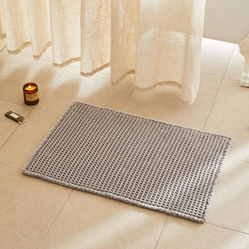 TYUU waffle bath mat with waffle texture adds plush comfort after shower.