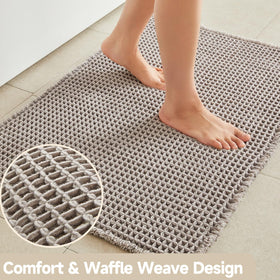TYUU waffle bath mat dries quickly to reduce moisture on floors.