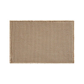 TYUU waffle bath mat enhances farmhouse or boho bathroom aesthetics.