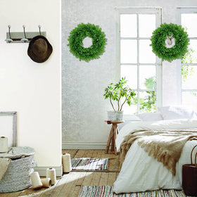 U'Artlines boxwood-style wreath adds year-round versatility to any space.