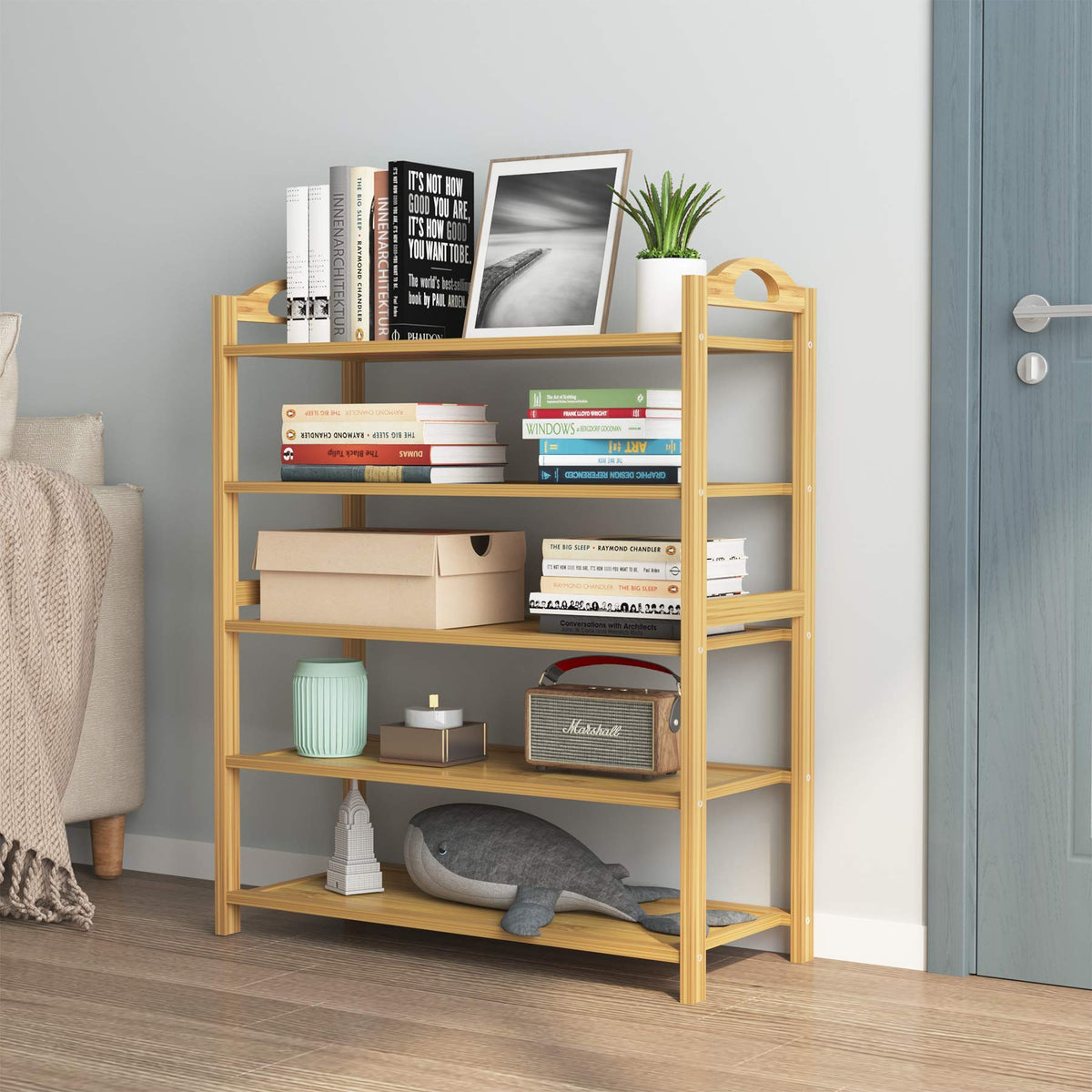 Adjustable shelves on the UDEAR bamboo rack accommodate boots and larger items.