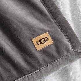 UGG Bliss Throw Blanket luxurious bed layer for cool evenings.