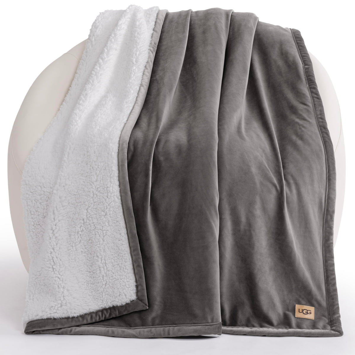 UGG Bliss Throw Blanket reversible grey fleece for cozy warmth and texture.