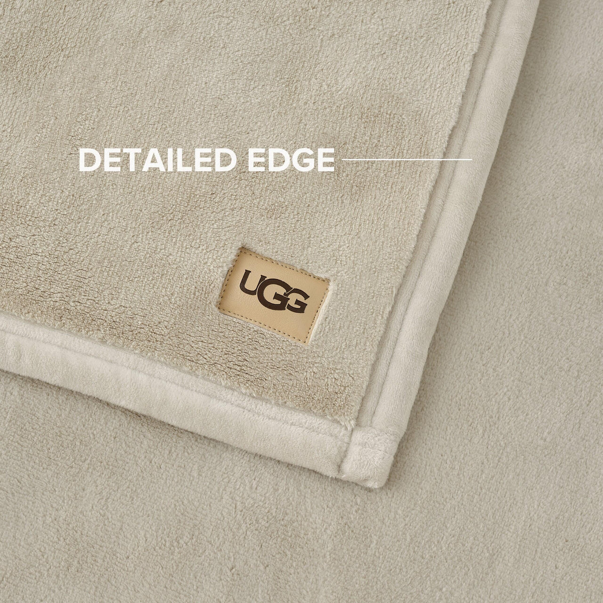 Ivory Shoreline Coco blanket displayed on bed adds luxurious texture.