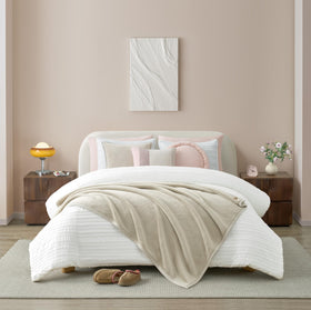 Ivory Coco fleece close-up reveals ultra-soft texture for snuggling.