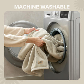UGG Coco throw scene with pet-friendly setup demonstrates easy care.