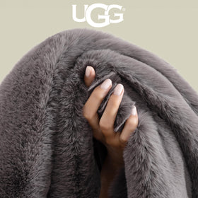 UGG Euphoria charcoal grey throw complements contemporary bedroom decor.