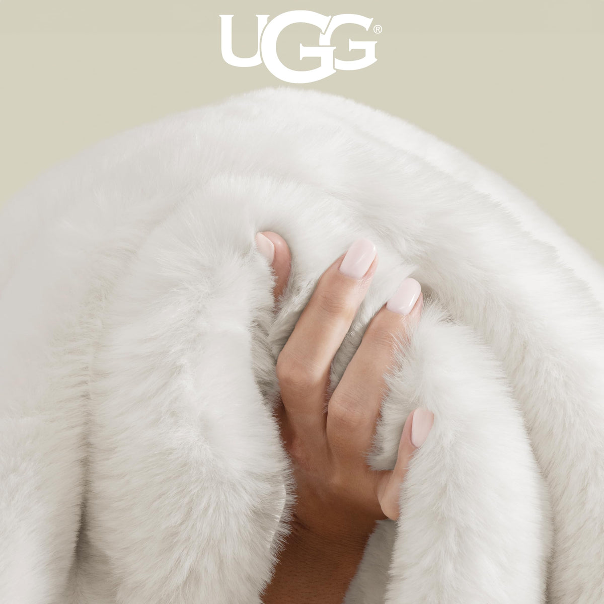 UGG Euphoria Faux Fur Throw layered on bed creates warmth