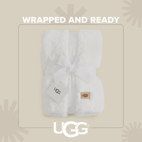 UGG Euphoria Faux Fur Throw draped on sofa adds luxury