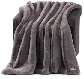 UGG Euphoria plush faux fur throw front view highlights ultra-soft texture for couch comfort.