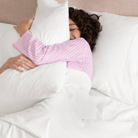 UGG Hedi queen on-bed visual demonstrates a calm, stylish bedroom setup with cooling sheets.