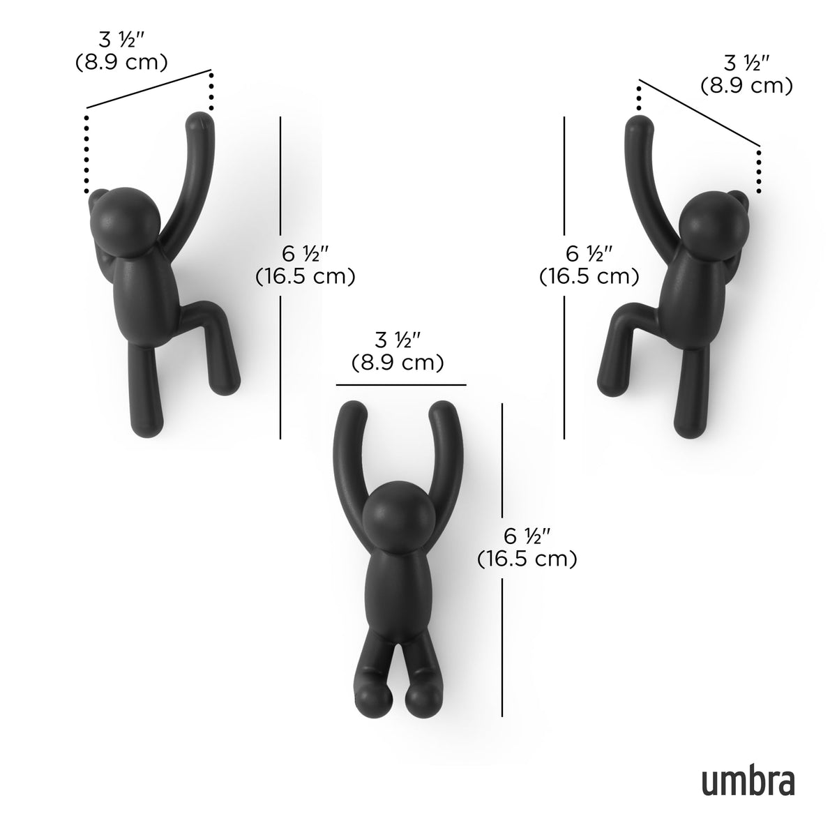 Umbra Buddy figure climbing the wall adds playful storage options.