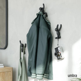 Umbra Buddy wall hooks mounted neatly for a clutter-free wall.