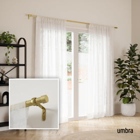 Umbra Cappa finial brass adds subtle modern detail to drapery.