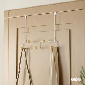 Umbra Estique five-hooks organizer keeps hats and bags within easy reach.