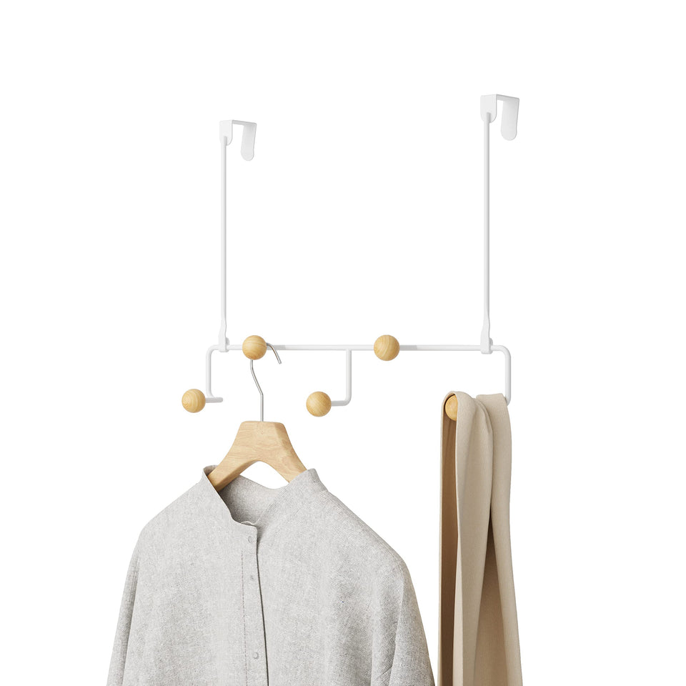 Umbra Estique over-the-door hook demonstrating space-saving entryway organization.