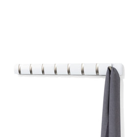 Umbra Flip 8-hook wall rack for space-saving coat storage.