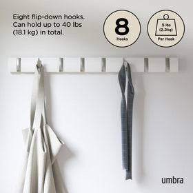 Umbra Flip holding coats, scarves, and bags in daily use.