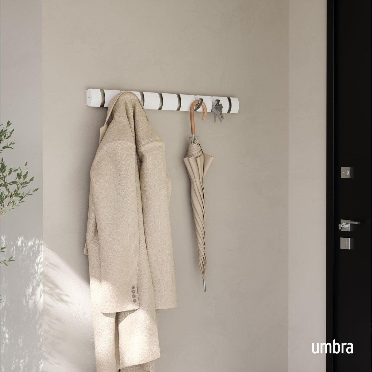 Umbra Flip retractable hooks close-up showing tidy storage.
