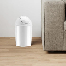 Umbra Mini white waste can in office setup with clean lines