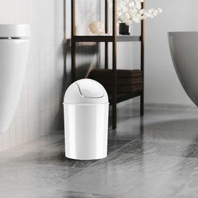 Umbra Mini white waste can under-desk use in a small space