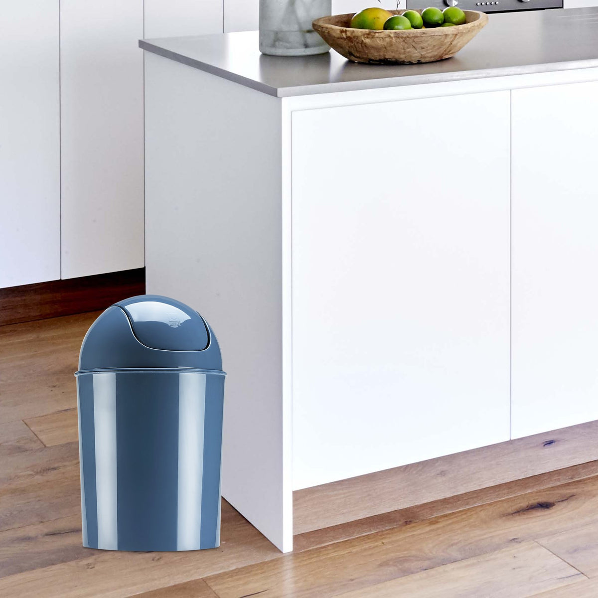 Sleek cylindrical design with domed swing-top lid for discreet waste