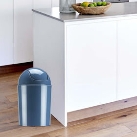 Sleek cylindrical design with domed swing-top lid for discreet waste