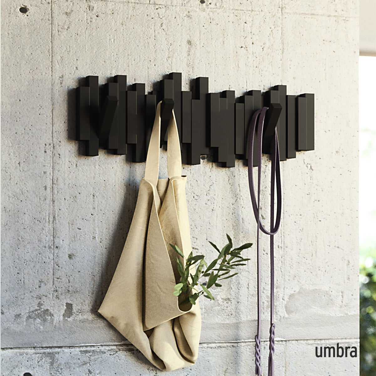 Umbra Sticks five flip-down hooks extended for quick everyday organization.